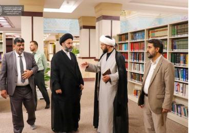 وفد من جامعتي الكوفة وفردوسي يطلع على تاريخ مكتبة الروضة الحيدرية المطهرة